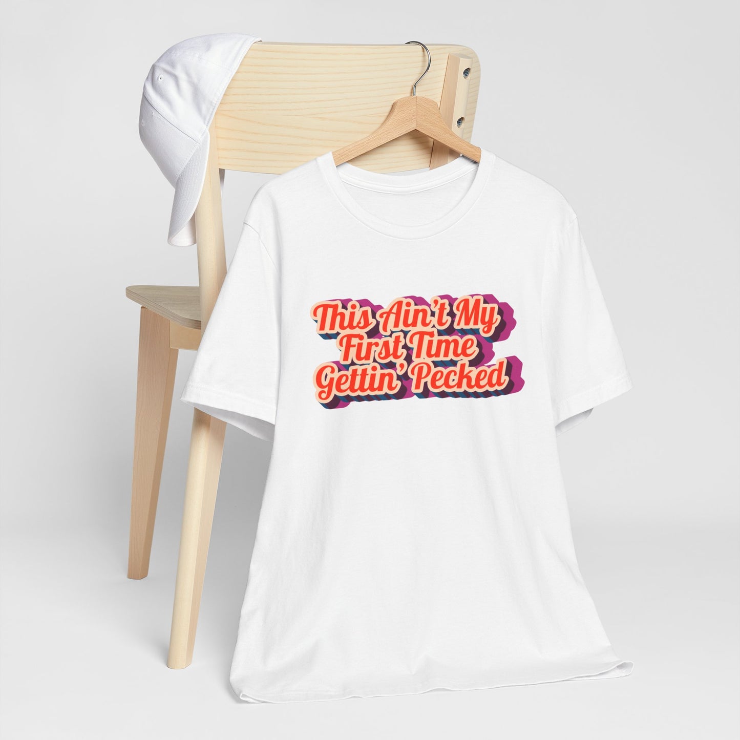 Humorous Unisex Tee - 'This Ain't My First Time Gettin' Pecked' Western Shirt | Country Girl Tee | Rustic Graphic Tee | Free Spirit Apparel | Outdoor Lifestyle Tee | Vintage Country Shirt | Softstyle Unisex Tee